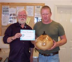 The monthly Highly commended Tony Handford received his certificate from Mervyn Firmager